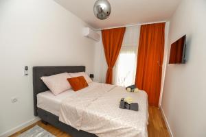 Postel nebo postele na pokoji v ubytování Apartman Darija 3
