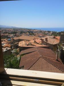 an aerial view of a city with roofs at Revibe Art Recidence in Scalea