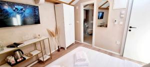 TV/Unterhaltungsangebot in der Unterkunft Mascheroni Luxury Rooms