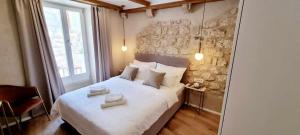 Ein Bett oder Betten in einem Zimmer der Unterkunft Mascheroni Luxury Rooms