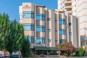 an office building with a building at Mansouri Mansions Hotel in Manama