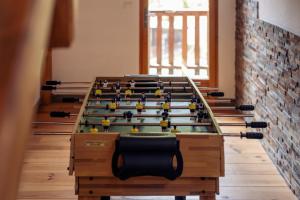 a room with a large table with a bunch of pins at la maison des cerries in Hautecour