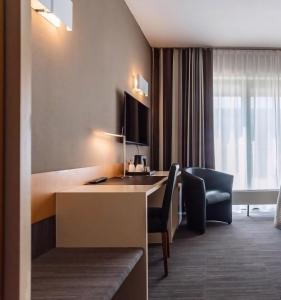 Postel nebo postele na pokoji v ubytování Hobbit Hotel Mechelen