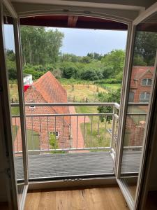 a room with a large window with a view at Ausspanne Dassow in Dassow