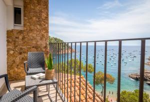 a balcony with a view of the ocean at Hotel Hostalillo by Escampa Hotels in Tamariu