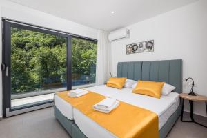 Postel nebo postele na pokoji v ubytování Villa Floris + 22 fotografií