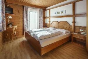 Säng eller sängar i ett rum på Pension Garni Plang