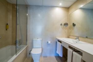 a bathroom with a toilet and a sink and a shower at Hotel Hostalillo by Escampa Hotels in Tamariu