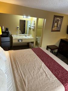 Un pat sau paturi într-o cameră la Wye Motel
