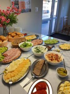 a table topped with lots of different types of food at OWR Piramida 2 in Darlowko