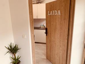 a door to a kitchen with the words laba written on it at LAGA&LAIDA APARTAMENTOS GERNIHOST en Urdaibai in Guernica y Luno