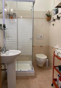 a bathroom with a shower and a sink and a toilet at B&B “il Pellicano” in Policoro