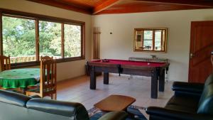 a living room with a pool table in it at Chacara na Serra da Mantiqueira in Santo Antônio do Pinhal