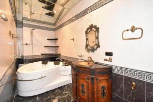 a bathroom with a toilet and a sink and a tub at Freedom Apartments on Mher Mkrtchyan in Yerevan