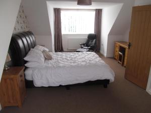 a bedroom with a bed with a teddy bear on it at The hideaway in Stockton-on-Tees