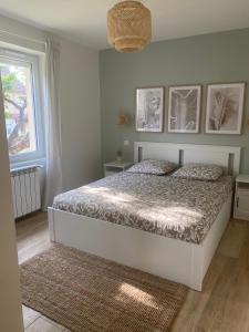 Ένα ή περισσότερα κρεβάτια σε δωμάτιο στο T3 Neuf, parking & garage privé, proche centre