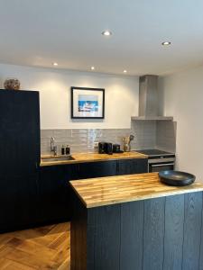 a kitchen with a counter top and a sink at Casa Clementine - Boutique Guesthouse in Veldhoven