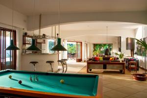 a pool table in the middle of a living room at Bougainvillea Retreat in Kandy