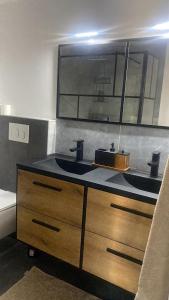 a bathroom with a sink and a mirror at B&B La Vieille Source in Saint-Martin-dʼArdèche