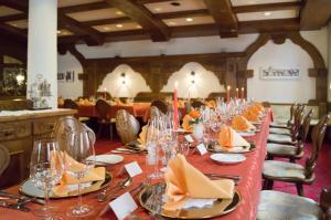 a long table with glasses and napkins on it at Hotel St.Martiner Castell in Sankt Martin +29 photos