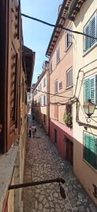 two children walking down a street in an alley at ELLE in Rovinj +7 photos