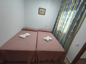 Postel nebo postele na pokoji v ubytování Edificio Entremares