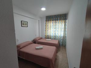 Postel nebo postele na pokoji v ubytování Edificio Entremares