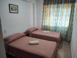 Postel nebo postele na pokoji v ubytování Edificio Entremares