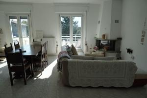 a living room with a couch and a table at Mountain View House in San Cassiano