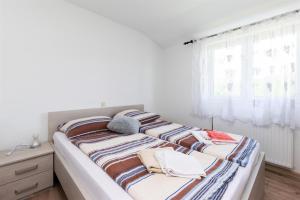 Postel nebo postele na pokoji v ubytování Apartments Boza