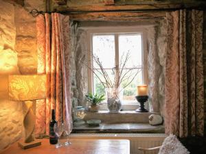 a window in a room with a table and a candle at Gorgeous romantic cosy cottage retreat with views in Winster
