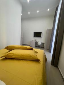 Cama o camas de una habitación en Dimora Chiaia 209