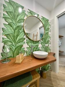 a bathroom with a mirror and a sink at Villa Costanza sorrento B&b in Sant'Agnello