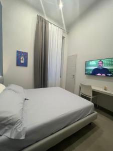 Cama o camas de una habitación en Dimora Chiaia 209