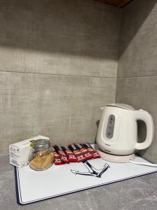a coffee maker and a toaster on a counter at Golden Lux Apartments in Skopje