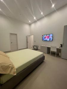 Cama o camas de una habitación en Dimora Chiaia 209