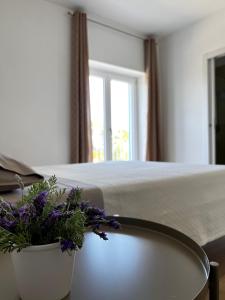 Postel nebo postele na pokoji v ubytování CASADOMA Casa Vacanza - B&B