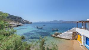 a view of a body of water with boats in it at Casa del Mar Milos in Areti