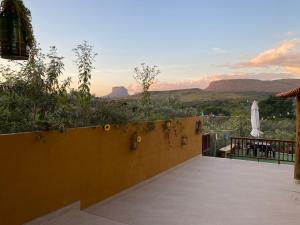 a patio with a view of the mountains at Chalé Capão Vibes in Vale do Capao