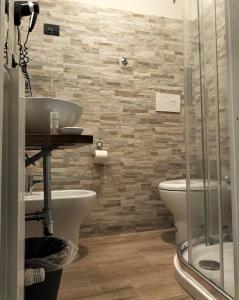 a bathroom with a sink and a toilet at Hotel Camilla Guelfa in Florence