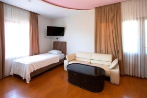 Letto o letti in una camera di Hotel Smile