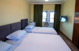 Letto o letti in una camera di Hotel Smile