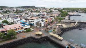 an aerial view of a town next to the water at Hotel Casa Blanca in Puerto Baquerizo Moreno