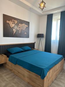 a bedroom with a bed with a map on the wall at Apartmani Kralj in Bar
