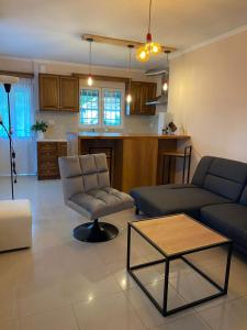 a living room with a couch and a table at Martin Villa Gjirokaster in Gjirokastër +11 photos