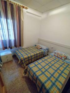 Postel nebo postele na pokoji v ubytování Casa DOLORES