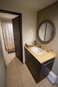 a bathroom with a sink and a mirror at Espectacular Loft a estrenar !! in Godoy Cruz