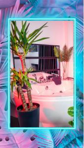 a bathroom with two palm trees and a bath tub at Apartment de Lux Craiova Jacuzzi Pat Rotund Semineu Zona Ford in Craiova