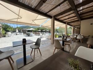 a restaurant with tables and chairs and a patio at Il Canneto in Sestri Levante