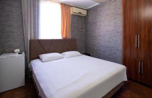 Letto o letti in una camera di Hotel Smile